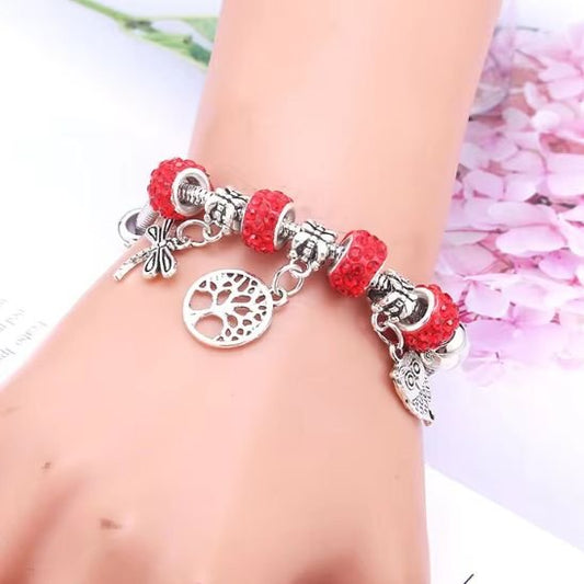 Bracelet a breloques style Pandora decore d un arbre de vie et de perles en verre colore pour un look naturel et elegant