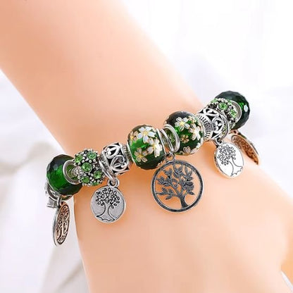  Ideal au quotidien ce bracelet en alliage argente arbore des breloques arbre de vie et des perles texturees pour un style unique